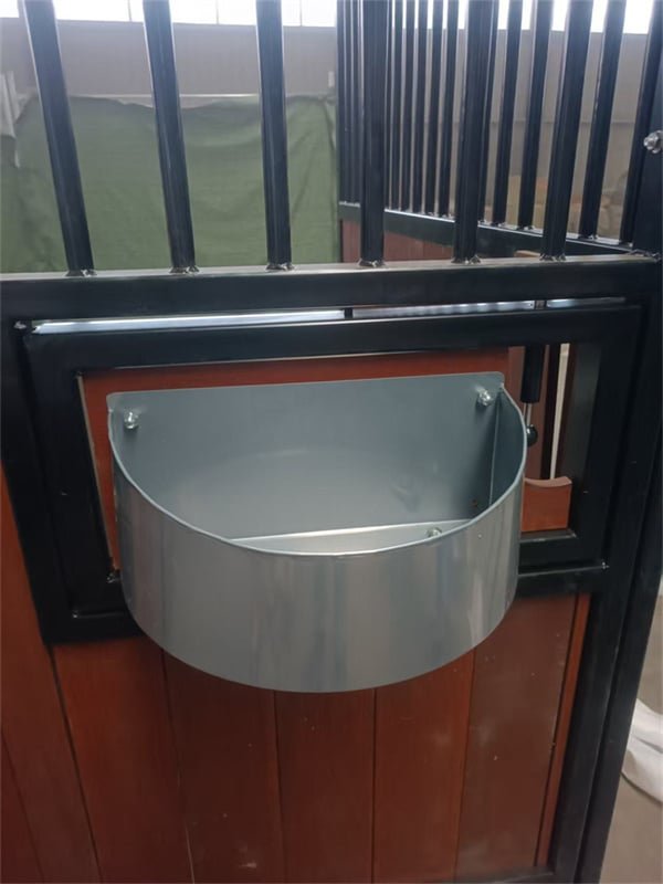 Craftsmen assembling a horse stable frame with quality materials